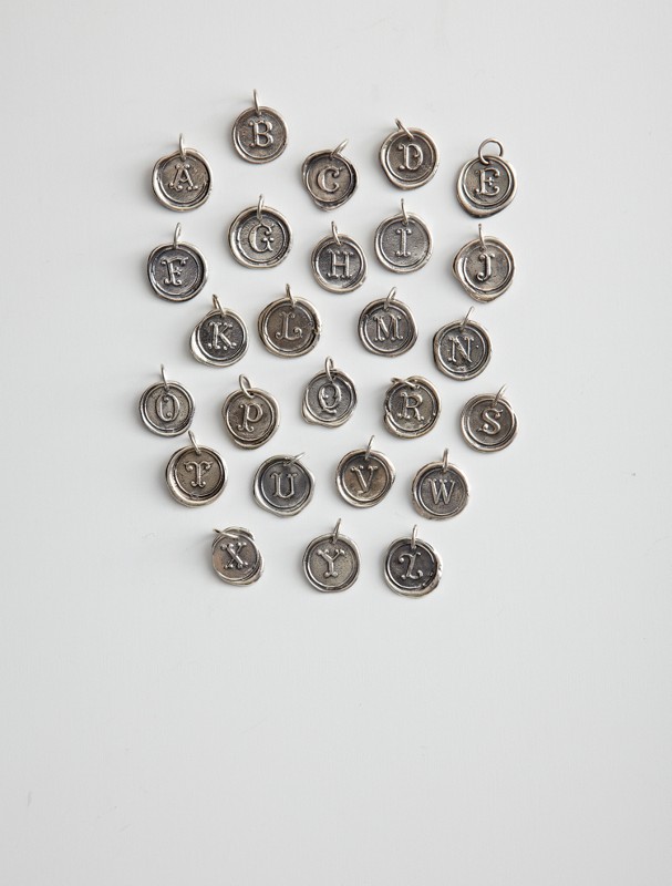 round insignia charm necklace